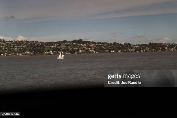 Amtrak's California Zephyr passes a sailboat on San Pablo Bay as it comes close to the end of its daily 2,438-mile trip to Emeryville/San Francisco...