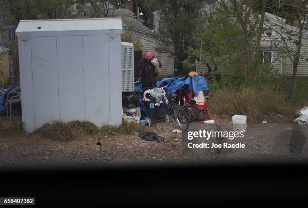 Homeless person is seen as Amtrak's California Zephyr passes through during its daily 2,438-mile trip to Emeryville/San Francisco from Chicago that...