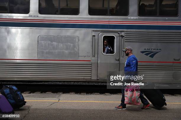 Passengers disembark at an Amtrak's California Zephyr train station during its daily 2,438-mile trip to Emeryville/San Francisco from Chicago that...