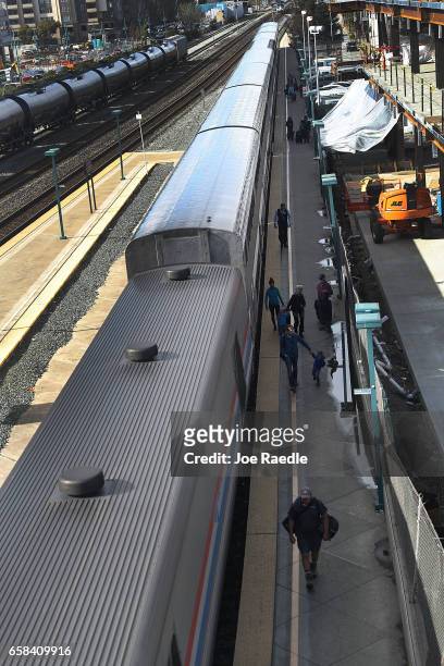 Passengers disembark from Amtrak's California Zephyr at the end of its daily 2,438-mile trip to Emeryville/San Francisco from Chicago that took...