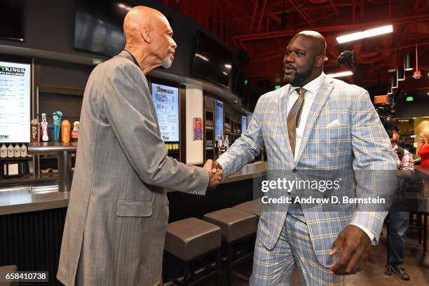 Kareem Abdul-Jabbar and Shaquille O'Neal shake hands during the Los Angeles Lakers unveiling of the Shaquille O'Neal statue on March 24, 2017 at...