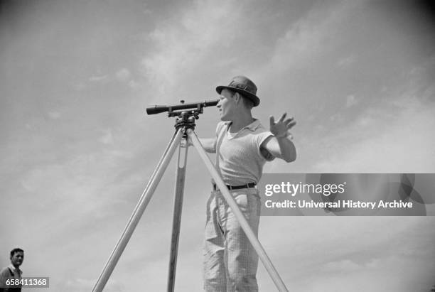 Surveyor Working in Model Community Planned by Suburban Division of U.S. Resettlement Administration, Greenbelt, Maryland, USA, Carl Mydans for U.S....