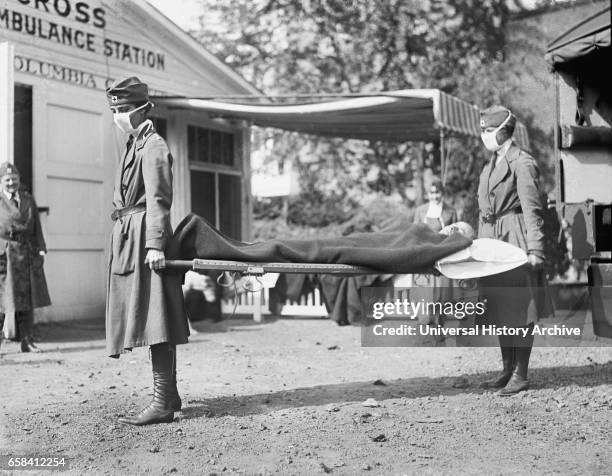 Demonstration at the Red Cross Emergency Ambulance Station during Influenza Pandemic, Washington DC, USA, National Photo Company, 1918.