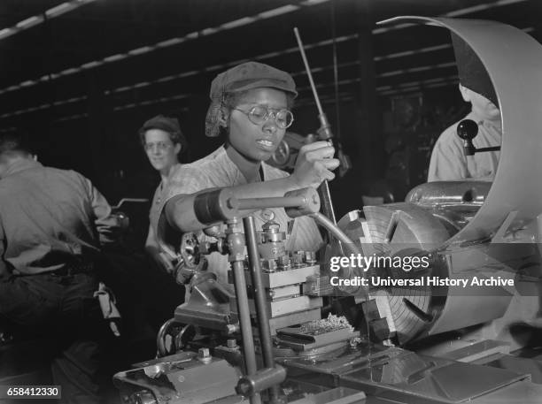 Female Lathe Operator at Aircraft Manufacturing Plant, Milwaukee, Wisconsin, USA, Ann Rosener for Office of War Information, October 1942.