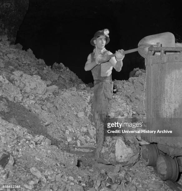 Worker Loading Zinc Ore in Mine to be used for many Purposes in the War Effort, near Cardin, Oklahoma, USA, Fritz Henle for Office of War...