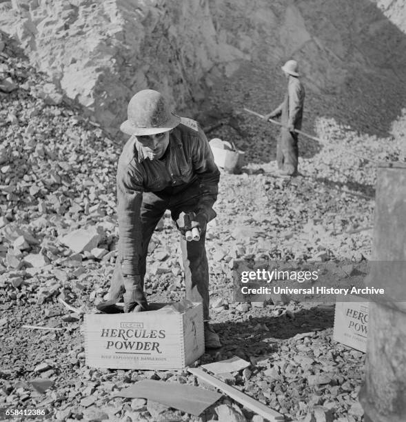 Man getting Ready to Blast Ore with Dynamite at Copper Mine, Bingham Canyon, Utah, USA, Andreas Feininger for Office of War Information, November...