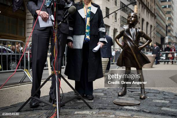 New York City Mayor Bill De Blasio and Manhattan Borough President Gail Brewer speak to reporters as they stand next to the 'Fearless Girl' statue...