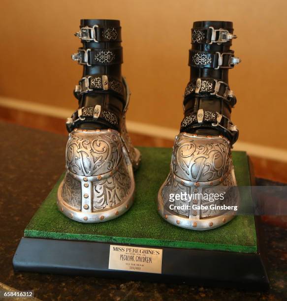 Replica of the boots worn by the character Emma in the movie "Miss Peregrine's Home for Peculiar Children" is displayed for auction during CinemaCon...