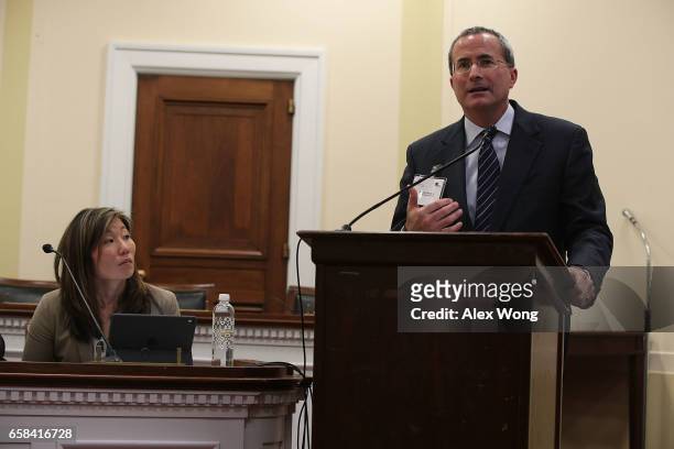 News Media Alliance President and CEO David Chavern speaks as Senior Vice President and General Counsel at Getty Images Yoko Miyashita listens during...