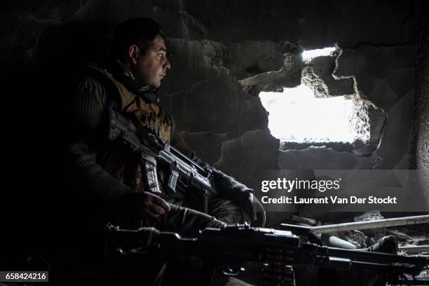 Soldier of the Iraqi Federal Police Emergency Response Division during a battle on their last position of the Wednesday Market, on the frontline...