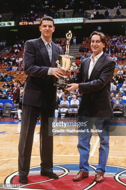 Drazen Petrovic of the New Jersey Nets is awarded the European Player of the Year Award during a game played circa 1993 at the Brendan Byrne Arena in...