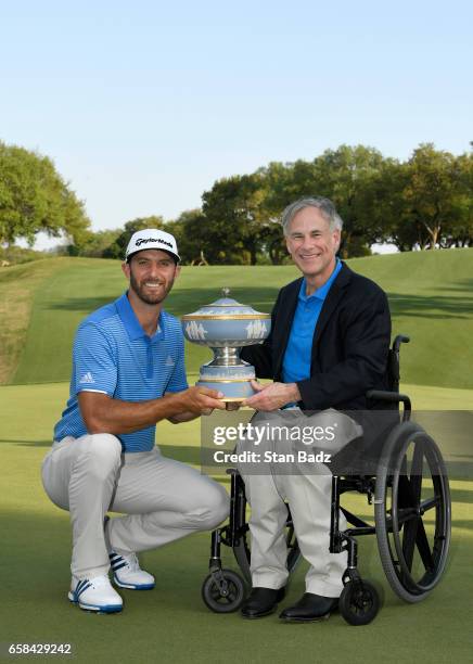 Dustin Johnson and Texas Governor Greg Abbott pose with the Waler Hagen Cup at the World Golf Championships - Dell Technologies Match Play at Austin...