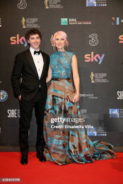 Michele Riondino and Eva Nestori walk the red carpet of the 61. David Di Donatello on March 27, 2017 in Rome, Italy.