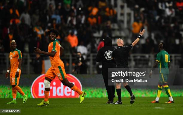 The referee abandons the match after repeated pitch invasions during the International Friendly match between the Ivory Coast and Senegal at the...