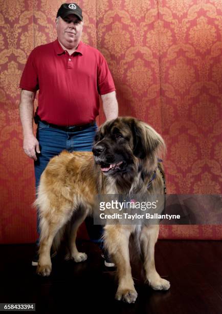 141st Westminster Dog Show: Portrait of Leonberger and handler backstage before Day 1 of Best of Breed Judging event at Pier 94. New York, NY...