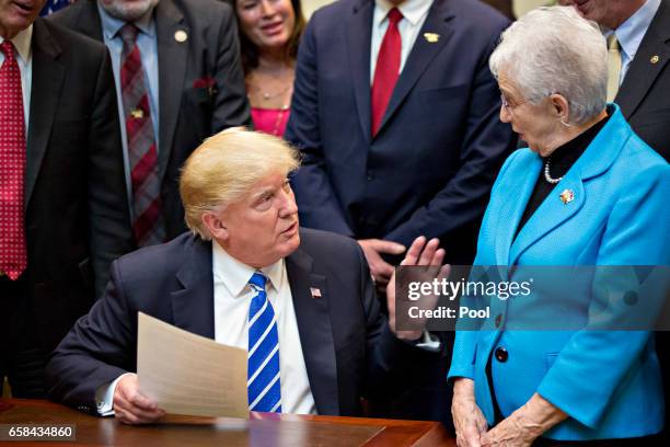 President Donald Trump speaks next to Representative Virginia Foxx, a Republican from North Carolina, right, during a bill signing ceremony in the...