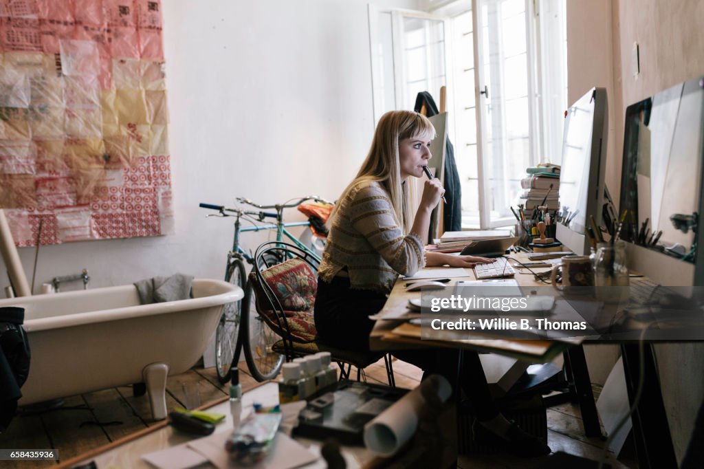 Young Creative woman working on computer