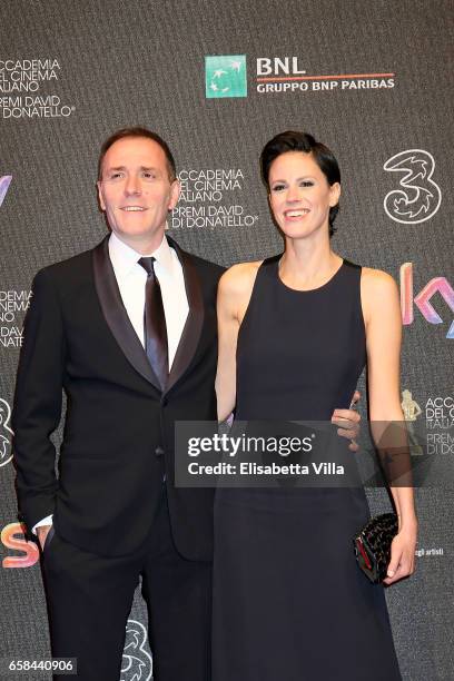 Valerio Mastandrea and Chiara Martegiani walk the red carpet of the 61. David Di Donatello on March 27, 2017 in Rome, Italy.