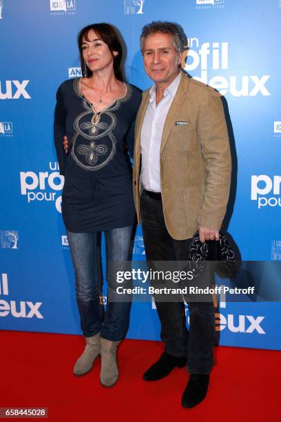 Delphine Rollin and Laurent Olmedo attend the "Un profil pour deux" Paris Premiere at Cinema UGC Normandie on March 27, 2017 in Paris, France.