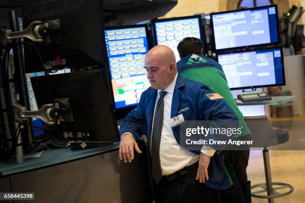 Traders work on the floor of the New York Stock Exchange ahead of the closing bell, March 27, 2017 in New York City. Today marked the eighth session...