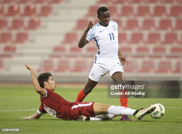 Edward Nketiah of England in action against Youssef Ayman of Qatar during the U18 International friendly match between Qatar and England at the Grand...