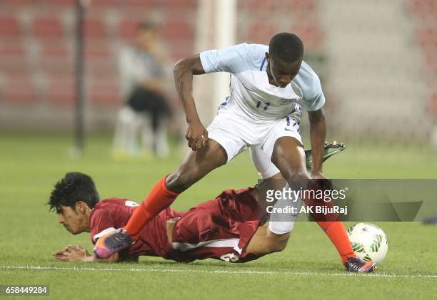 Edward Nketiah of England in action against Ahmed Minhali of Qatar during the U18 International friendly match between Qatar and England at the Grand...