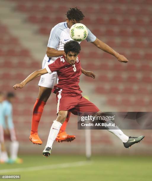 Reece James of England in action against Ahmed Minhali of Qatar during the U18 International friendly match between Qatar and England at the Grand...