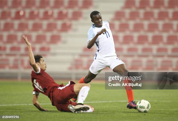 Edward Nketiah of England in action against Youssef Ayman of Qatar during the U18 International friendly match between Qatar and England at the Grand...