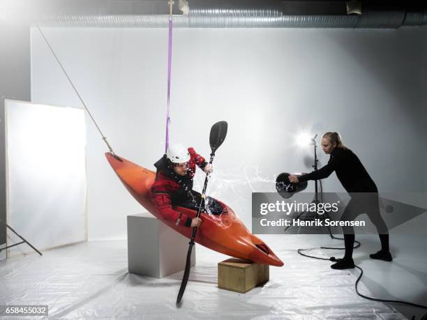 male canoer being splashed in a studio - behind the scenes stock pictures, royalty-free photos & images