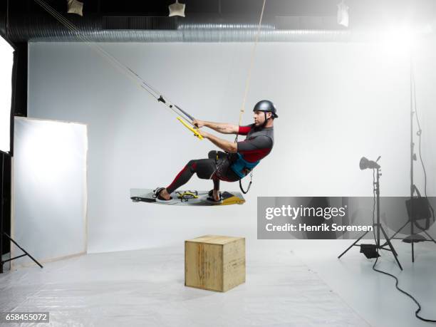 male kitesurfer in a studio - kite surfing stock pictures, royalty-free photos & images