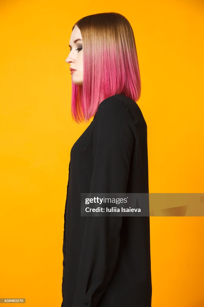 Stylish female isolated on orange