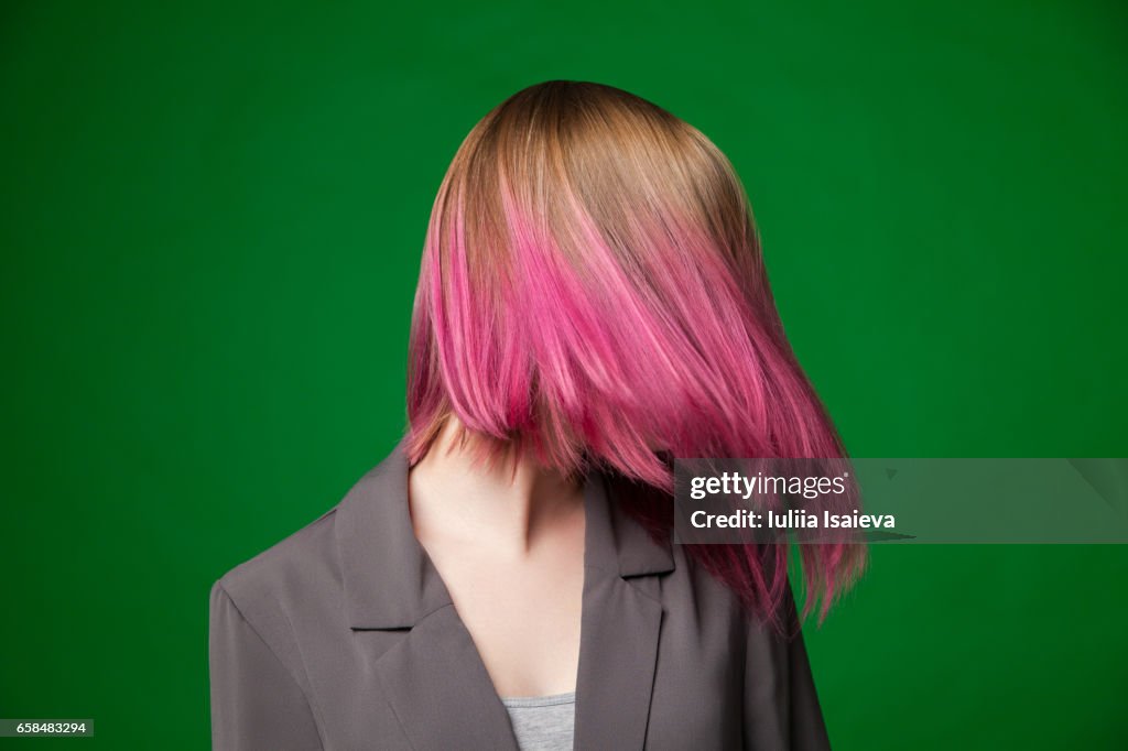 Female with dyed hair posing