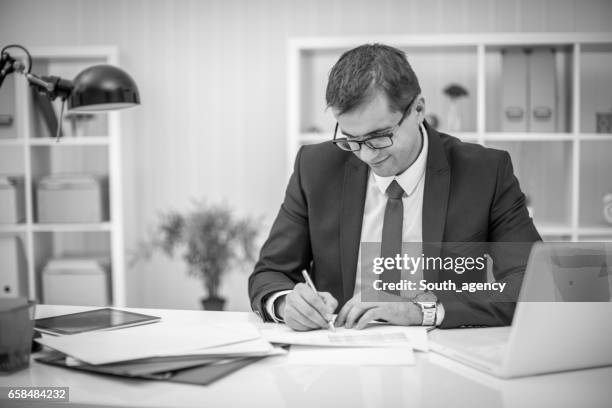 writing it down - candid black and white corporate stock pictures, royalty-free photos & images