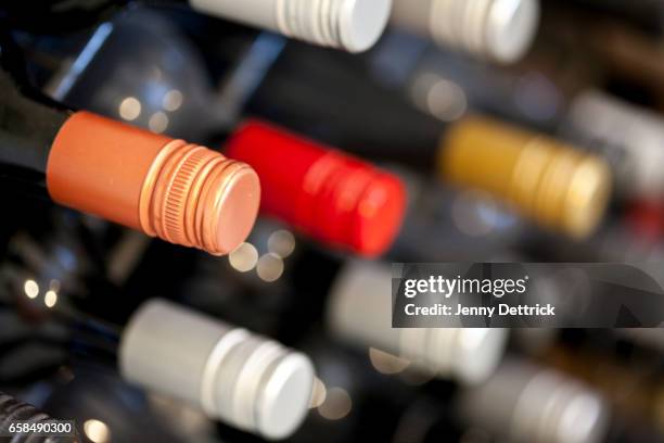 close-up of wine bottles - wine rack stock pictures, royalty-free photos & images