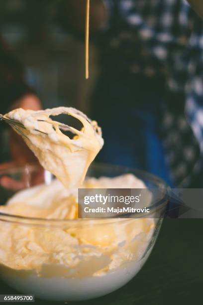 close up of cream cheese frosting mixed up in a glass bowl - texture mousse stock pictures, royalty-free photos & images