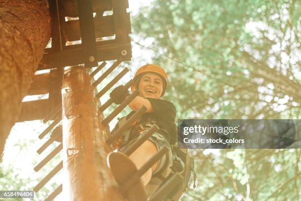 moving up on obstacle course - climber stock pictures, royalty-free photos & images