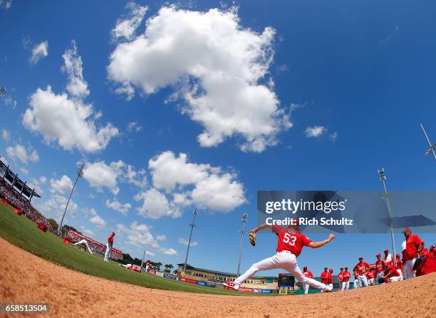 Pitcher John Gant of the St. Louis Cardinals warms up in the bullpen before a spring training baseball game against the Atalanta Braves at Roger Dean...