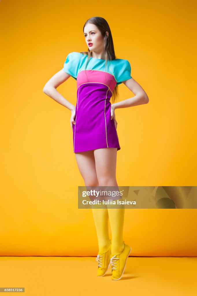 Pretty woman in colorful dress