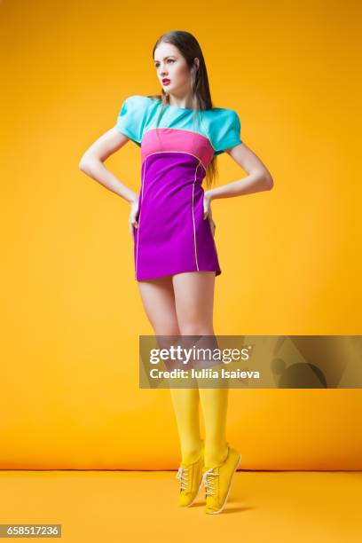 pretty woman in colorful dress - multi colored dress stock pictures, royalty-free photos & images