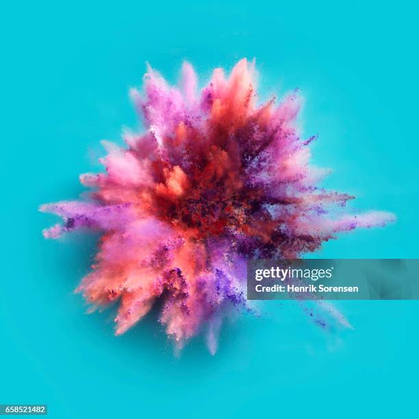 colorful powder explosion - fondo turquesa fotografías e imágenes de stock