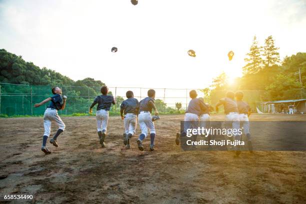 youth baseball players, teammates - kids baseball field stock pictures, royalty-free photos & images