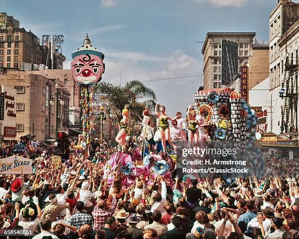 1960s MARDI GRAS REX PARADE ON CANAL STREET FEBRUARY 14 1961 CROWD REACHING FOR TRINKETS NEW ORLEANS LA USA