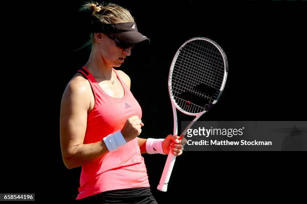 Mirjana Lucic-Baroni of Croatia celebrates a point against Bethanie Mattek-Sands during the Miami Open at the Crandon Park Tennis Center on March 27,...