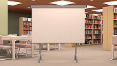 Big library with large projector screen, table,chairs and bookshelves.