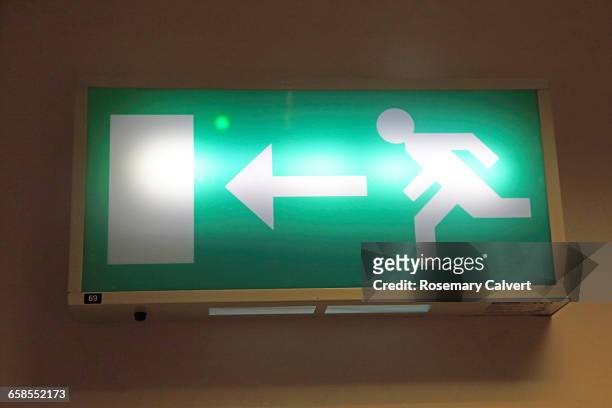 disaster preparedness  - fire exit sign stock pictures, royalty-free photos & images