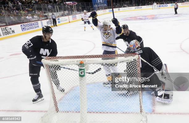 Viktor Arvidsson of the Nashville Predators celebrates his goal at 3:15 of the second period against the New York Islanders at the Barclays Center on...