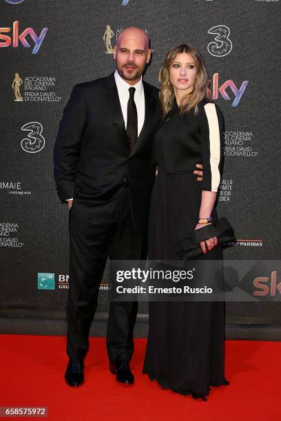 Marco D'Amore and Daniela Maiorana walk the red carpet of the 61. David Di Donatello on March 27, 2017 in Rome, Italy.