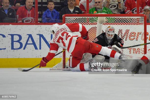 Carolina Hurricanes Goalie Eddie Lack is injured as the game winner by Detroit Red Wings Winger Andreas Athanasiou sneaks past him in overtime in a...