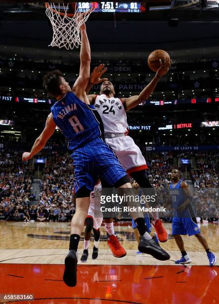 Toronto Raptors guard Norman Powell to the iron against Orlando Magic guard Mario Hezonja . Toronto Raptors vs Orlando Magic in 1st half action of...