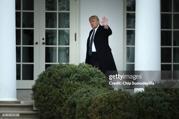 President Donald Trump walks along the West Wing colonnade before departing the White House March 17, 2017 in Washington, DC. The first family is...